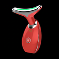 Red handheld LED facial massager for anti-aging skincare